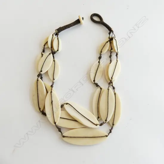 A long bone necklace,